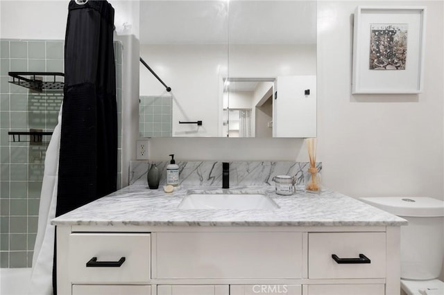 full bath featuring toilet and vanity