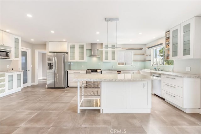 kitchen with open shelves, stainless steel appliances, white cabinets, and wall chimney range hood