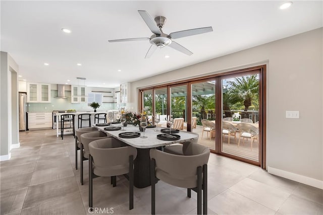 dining space with light tile patterned floors, recessed lighting, baseboards, and ceiling fan