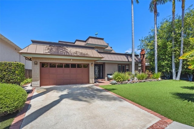 26925 Calle Dolores, Dana Point, CA 92624 - view of front of property featuring a standing seam roof, a metal roof, and a front lawn