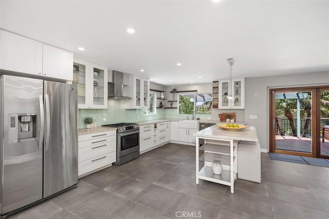 26925 Calle Dolores, Dana Point, CA 92624 - kitchen with appliances with stainless steel finishes, open shelves, wall chimney exhaust hood, healthy amount of natural light, and recessed lighting