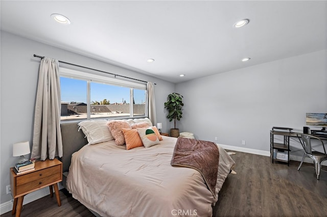 bedroom with dark wood-type flooring, recessed lighting, and baseboards