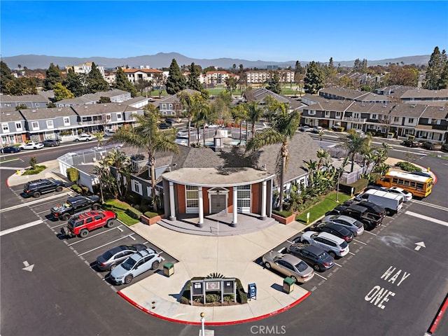 birds eye view of property with a residential view and a mountain view