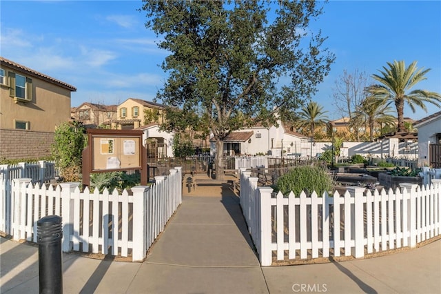 view of front of home featuring a fenced front yard and a residential view