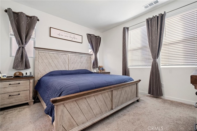 bedroom with carpet flooring and baseboards