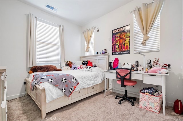bedroom with carpet flooring and baseboards