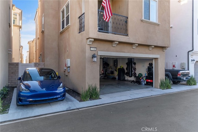 view of property featuring driveway and an attached garage