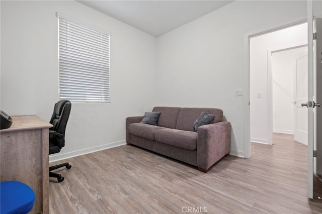 home office featuring baseboards and light wood-style floors