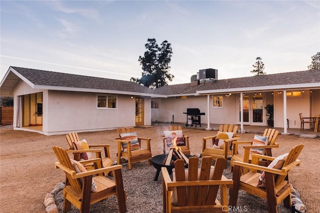 4883 Avenida La Candela, Joshua Tree, CA 92252 - back of house featuring an outdoor fire pit and a patio area