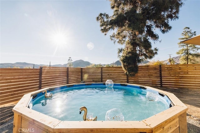 4883 Avenida La Candela, Joshua Tree, CA 92252 - view of swimming pool with a mountain view