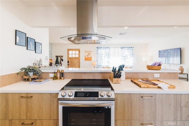 4883 Avenida La Candela, Joshua Tree, CA 92252 - kitchen featuring stainless steel electric range, island range hood, modern cabinets, and light countertops