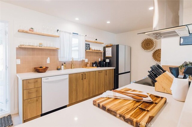 4883 Avenida La Candela, Joshua Tree, CA 92252 - kitchen with white dishwasher, ventilation hood, open shelves, light countertops, and decorative backsplash