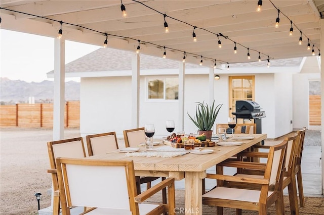 4883 Avenida La Candela, Joshua Tree, CA 92252 - view of patio featuring outdoor dining space, area for grilling, and a mountain view