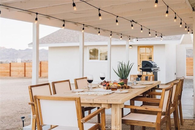 4883 Avenida La Candela, Joshua Tree, CA 92252 - view of patio featuring outdoor dining space, area for grilling, and a mountain view