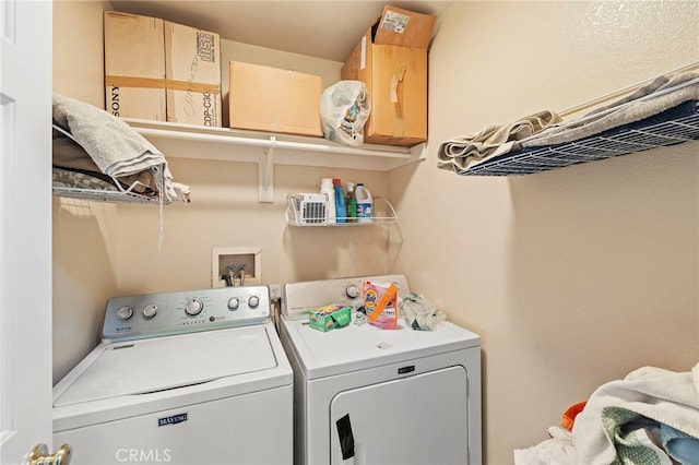 clothes washing area featuring laundry area and washer and dryer