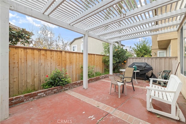 view of patio / terrace with outdoor dining area, a fenced backyard, grilling area, and a pergola