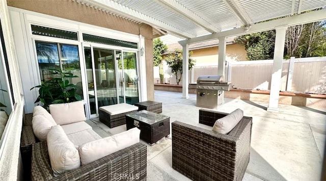 view of patio with area for grilling, a fenced backyard, and an outdoor living space