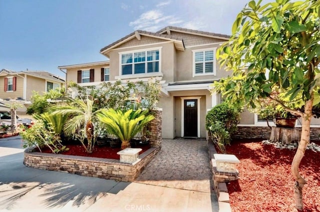 craftsman-style house with stucco siding