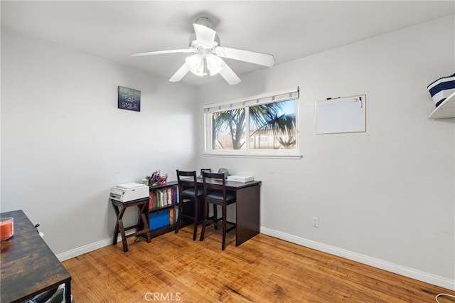 home office with wood finished floors, baseboards, and ceiling fan