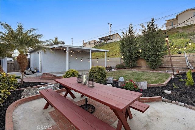 view of patio with outdoor dining area and a fenced backyard