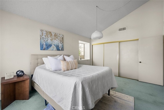 carpeted bedroom with high vaulted ceiling, a closet, visible vents, and a textured ceiling