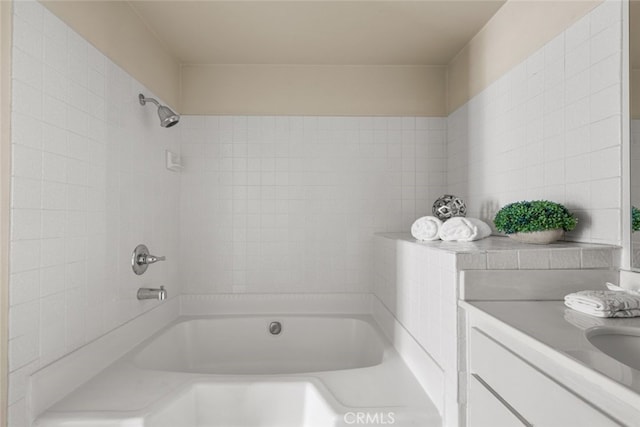 full bath featuring vanity and bathing tub / shower combination