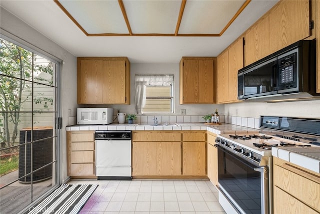 kitchen with white appliances and a sink