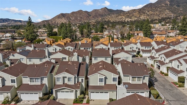 bird's eye view with a residential view and a mountain view