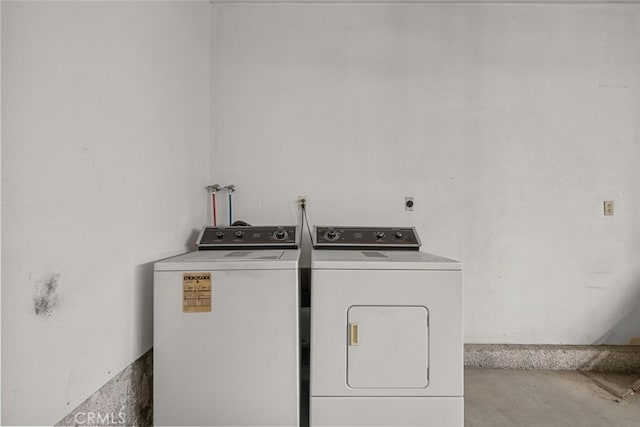 washroom with washer and dryer and laundry area