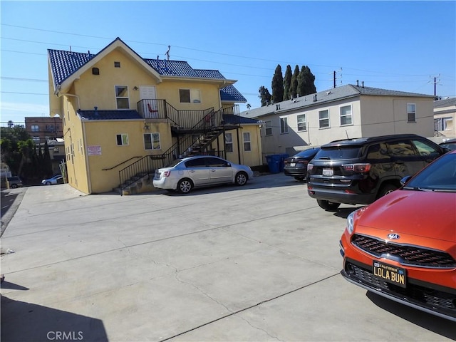 view of parking / parking lot with stairs