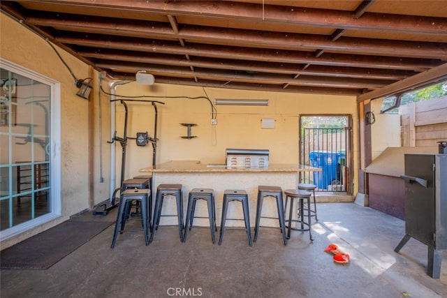 view of patio featuring an outdoor bar