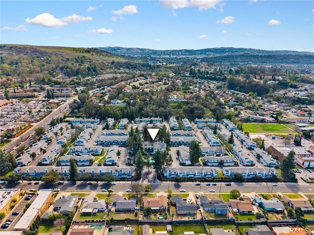 birds eye view of property with a mountain view and a residential view