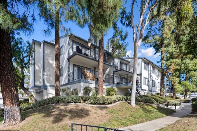 view of property with a residential view and stairway