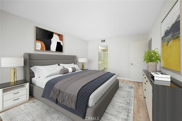 1694 Bridgeport, West Covina, CA 91791 - bedroom with light wood-type flooring and connected bathroom