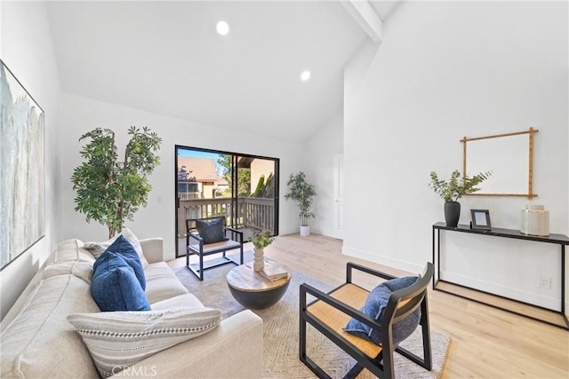 living room with light wood-type flooring, baseboards, high vaulted ceiling, and recessed lighting