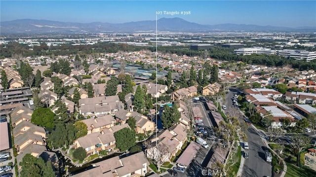 drone / aerial view featuring a residential view and a mountain view