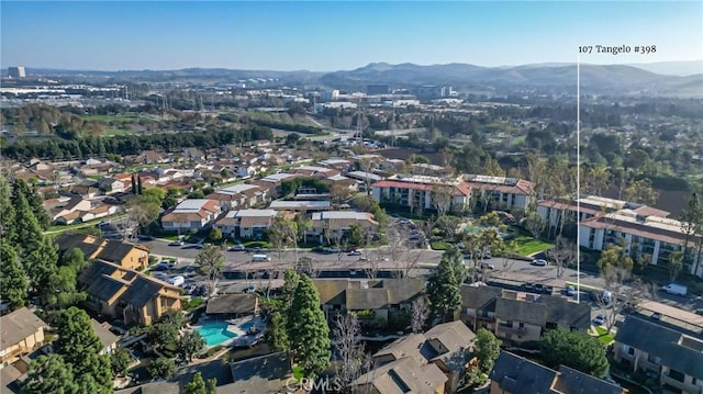 birds eye view of property featuring a mountain view