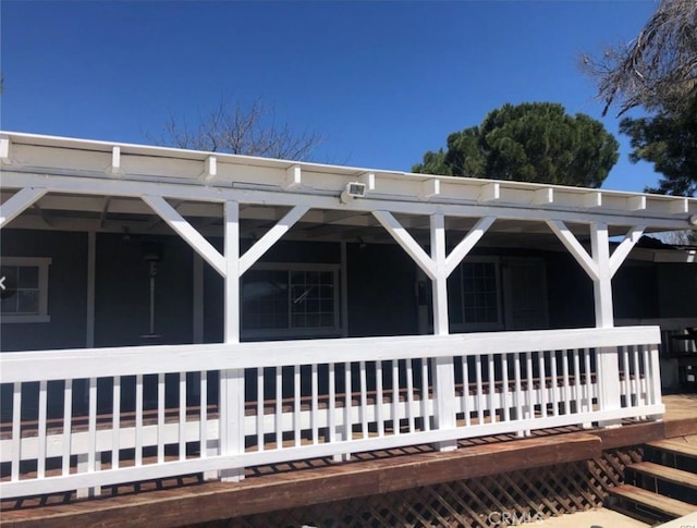 view of side of property with covered porch