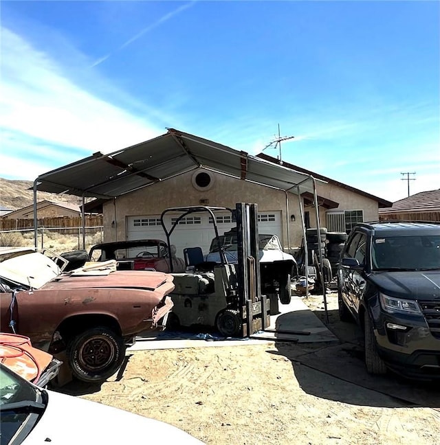 view of car parking featuring a garage