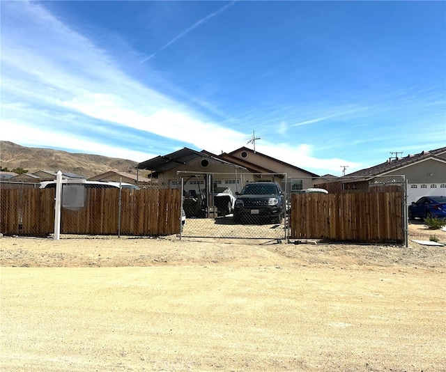 view of yard with a fenced front yard and a gate