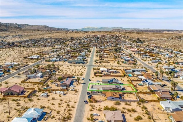 drone / aerial view with a mountain view and view of desert