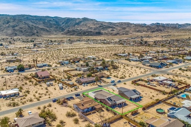 aerial view with a mountain view and a desert view