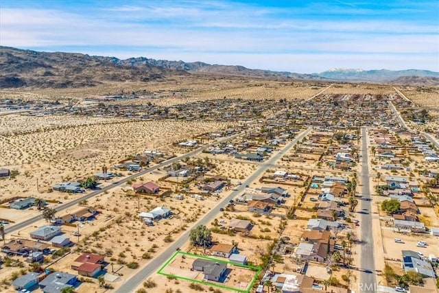 bird's eye view with a mountain view and a desert view