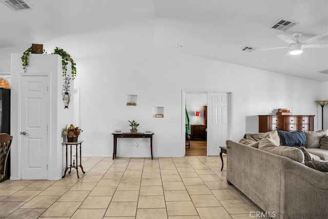 living area featuring light tile patterned floors, visible vents, and ceiling fan