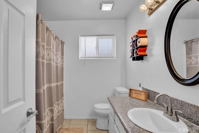 bathroom with tile patterned floors, visible vents, toilet, and vanity