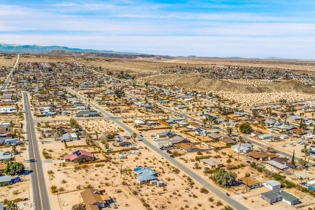 bird's eye view with a mountain view and a desert view