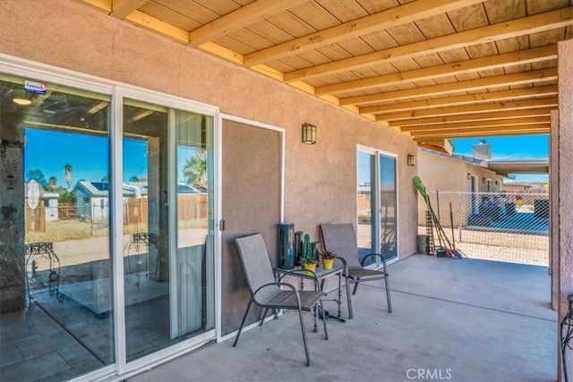 view of patio / terrace featuring fence