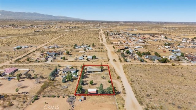 birds eye view of property with a rural view, a desert view, and a mountain view