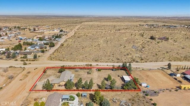 drone / aerial view with a desert view and a rural view