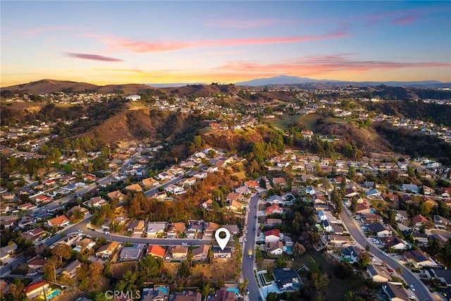 drone / aerial view with a residential view and a mountain view